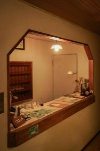 a mirror on the wall of a room at Local Knot Backpackers in Nagano