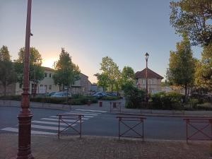 a street with benches on the side of a road at Entre sarre et albe in Sarralbe