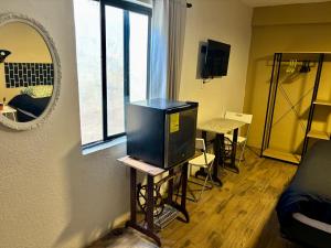 Televisyen dan/atau pusat hiburan di Casa Ufemia habitacion 1 +11 gambar