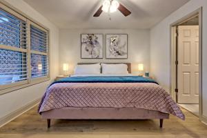 a bedroom with a bed and a ceiling fan at Alpine Studio in Helen +5 photos