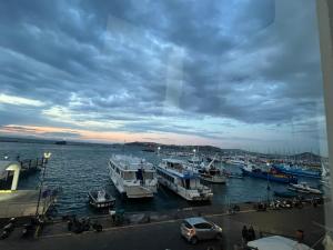 a group of boats docked in a harbor at Casa MiraMare in Procida +28 photos