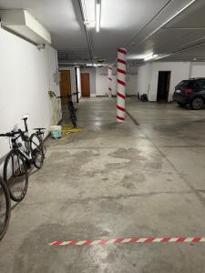a parking lot with bikes parked in a parking garage at Chalet Campiglio Imperiale in Madonna di Campiglio +30 photos