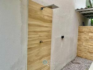 a wooden door in the side of a building at Samburá Residece By 123Quarto in Camalaú +25 photos
