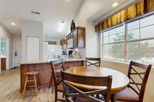 a kitchen with a table and chairs and a counter at Lantern Bay Retreat in Branson