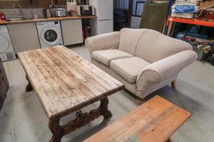 a living room with a couch and a coffee table at Robin in Woodbridge