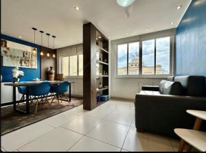 a living room with a couch and a table at Best 2 bedroom condo 3 bathroom in Rio de Janeiro