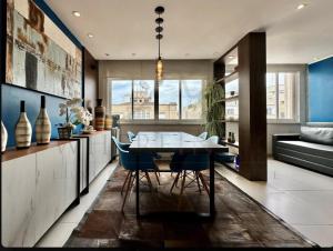 a kitchen with a table and chairs in a room at Best 2 bedroom condo 3 bathroom in Rio de Janeiro