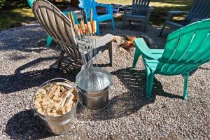 a group of chairs and a fire in a yard at Glacier Cabins in Martin City