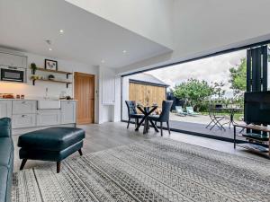 a living room with a table and a large window at 1 Bed in Redruth oc-92281 in Redruth