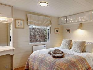 a bedroom with a bed and a window at 2 Bed in Lutterworth oc-93762 in Boughton