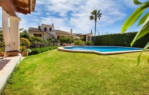 a backyard with a swimming pool and grass at Ca Na Rosa De Selva in El Port de la Selva