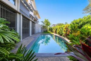 an image of a swimming pool in front of a building at Perfect in Parap in Paraparap
