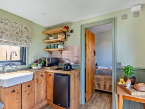 a kitchen with a sink and a stove at 1 Bed in Hawarden oc-93595 in Hawarden