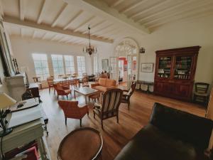 a living room with a table and chairs at Gîte De Charme - La Mésangerie in Saint-Satur