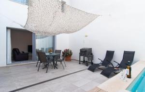 a living room with a table and chairs at Petit Arta - Sa Botigueta in Artá +29 photos