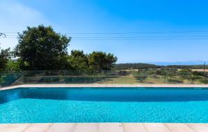 a swimming pool with a view of a field at Mater Randa in Algaida