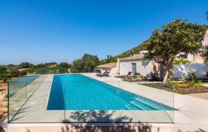 a swimming pool in front of a house at Mater Randa in Algaida +39 photos