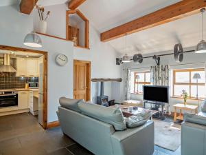 a living room with a couch and a table at 3 Bed in Conwy oc-95906 in Conwy
