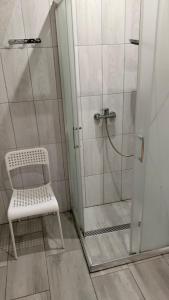 a shower with a white bench in a bathroom at Chata Romanka in Sopotnia Mała +33 photos