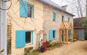 a house with blue shutters on the side of it at Awesome Home In Charritte-De-Bas With Wifi in Charritte-de-Bas