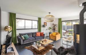 a living room with a couch and a table at Villa Botero Dinard in Dinard