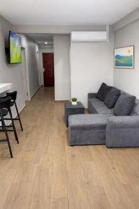 a living room with a couch and a table at Southgate Residence in Paramaribo