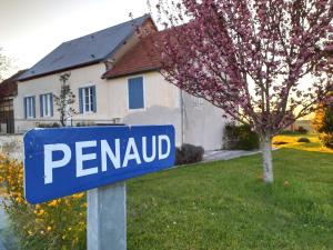 a blue sign in front of a house at Le Gîte Du Vigneron in Saulcet