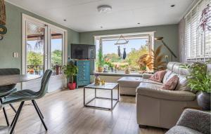 a living room with a couch and a table at Nice Home In Erm With Wifi in Erm