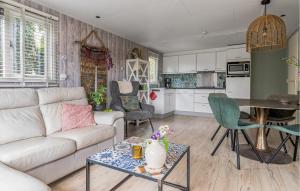 a living room with a couch and a table at Nice Home In Erm With Wifi in Erm