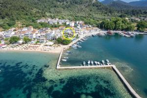 an aerial view of a beach with a ferris wheel at The Old Port in Limenas