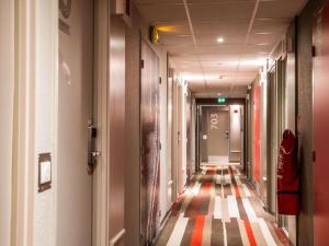 a corridor of an office building with a hallway at ibis Paris Bercy Village in Paris +135 photos