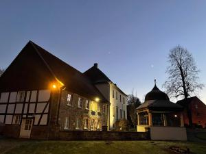 a large house with lights on the side of it at Feriennest Balve in Balve
