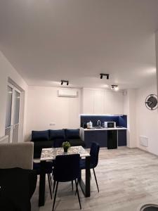 a living room with a couch and a table at Apartament Raj in Biała Podlaska