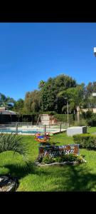 a park with a playground in the grass at Hostel francis in Tristán Suárez