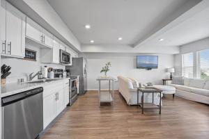 a kitchen and living room with a couch and a table at Steps to Dome Breathtaking views parking AC! in Tacoma +27 photos