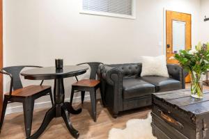 a living room with a couch and a table at 6th Ave district studio Quiet Prkng in Tacoma +19 photos