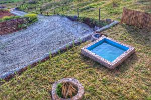 a swimming pool in the middle of a yard at Mirador el Prado in Cheqquerec +12 photos
