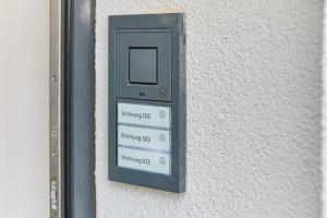 a cell phone is attached to a wall at Burgblick Apartment Weinlaub in Bernkastel-Kues