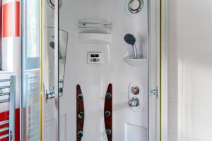 a pair of skis are hanging on a wall at Paradise Garden Villa in Bečići +26 photos