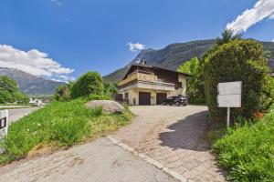 a house on the side of a road at Cozy Studio in Brig in Gamsen