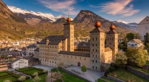 an aerial view of a castle with mountains in the background at Cozy Studio in Brig in Gamsen