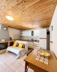 a bedroom with a bed and a wooden ceiling at Casa Vacanze Marisa in Sesta Godano