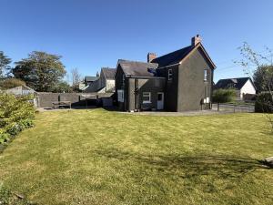 a house with a large lawn in front of it at 3 Bed in Narberth oc-79443 in Narberth