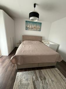 a bedroom with a large bed in a room at Villa Marea in Nin