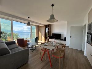 a living room with a couch and a table at SANI Apartments by Kanevce in Ohrid