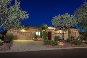 a house with a driveway at night at Caledonia Dreamin in Phoenix