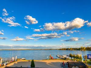 a view of a large body of water with boats at Villa Malibu in Zegrze Południowe