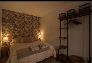 a bedroom with a bed and aroll at Apartamento El mirador de Olite in Olite