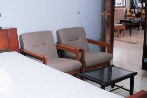 two chairs and a table in a room at Atlasio House in Kasri