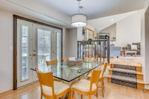 a dining room with a glass table and chairs at The KANtucky Derby Home in Derby